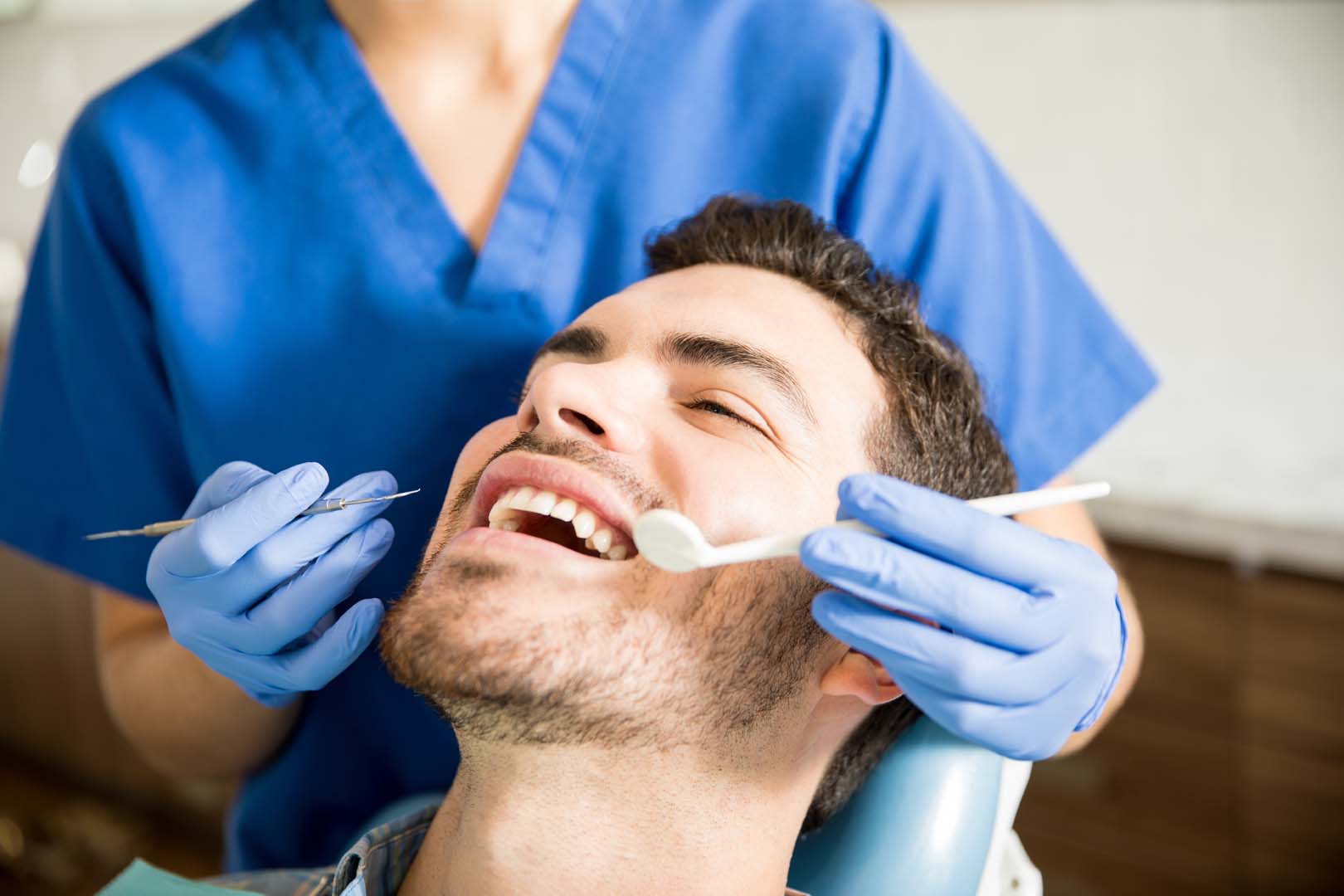 Patient receiving a routine dental exam and cleaning at Glassell Dental